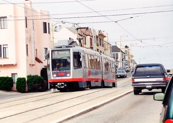 Proposed design for dedicated light rail alignments, retaining 4 lanes of traffic, could resemble San Francisco's Muni Metro N-Judah light rail alignment in Judah St., seen here near 16th Ave. Photo: (copyright) Eric Haas.